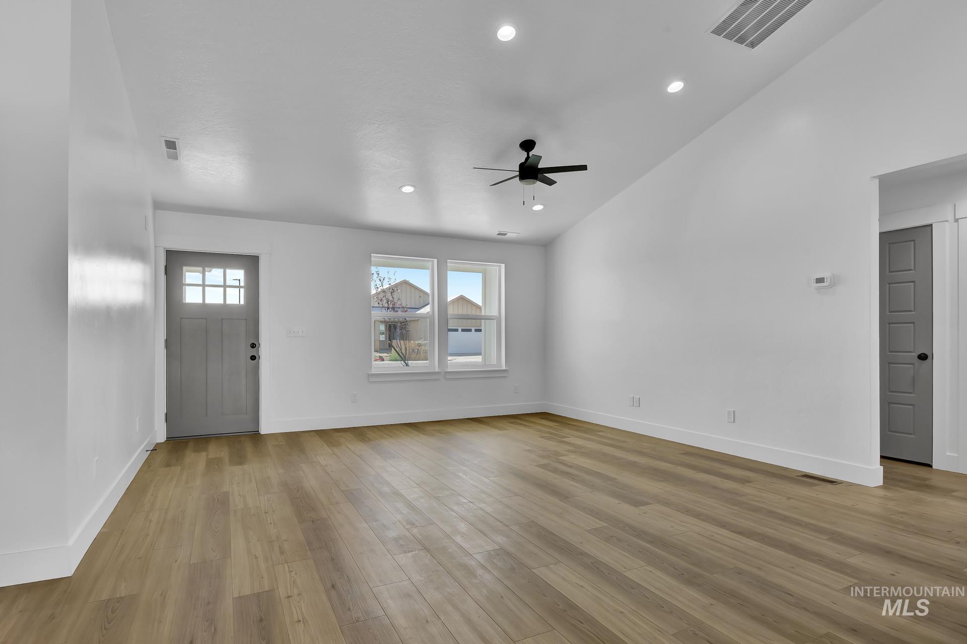1160 Velvet Loop Wilder, ID 83676 - Photo 3 of 29 Foyer featuring light wood-style flooring, recessed lighting, high vaulted ceiling, and a ceiling fan