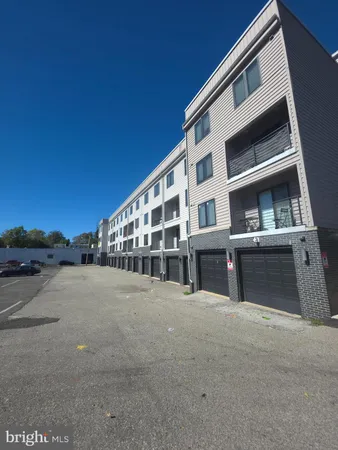 a view of building with yard and mountain view