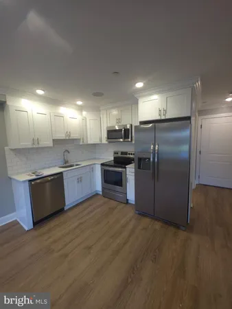 a large kitchen with a large window in a kitchen