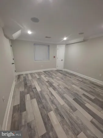 an empty room with wooden floor