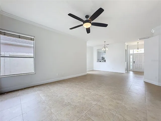 a view of an empty room with a window