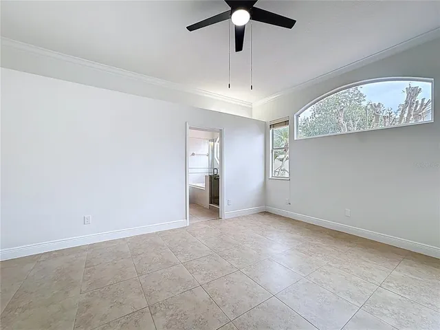en view interior of a house with wooden floor and chandelier