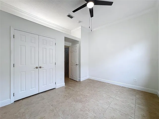 a bathroom with a shower a toilet and a sink