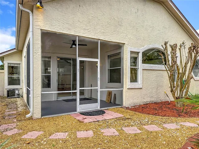 an aerial view of a house with a swimming pool yard and outdoor seating