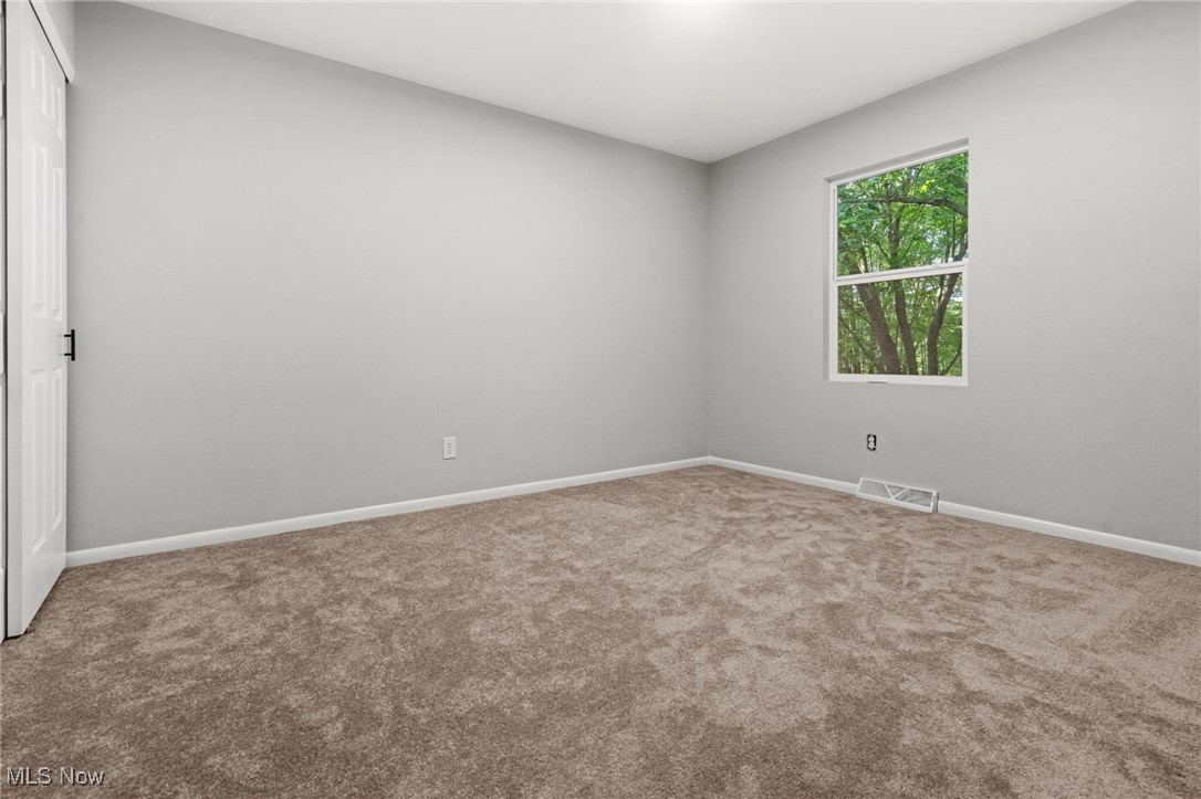 4232 Wilson Avenue Ravenna, OH 44266 - Photo 19 of 28 Carpeted empty room featuring baseboards