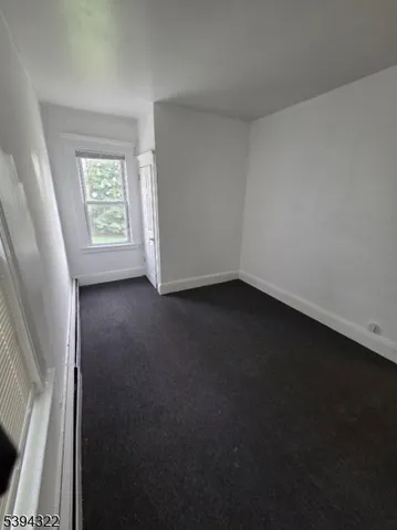 a kitchen with a refrigerator and a stove