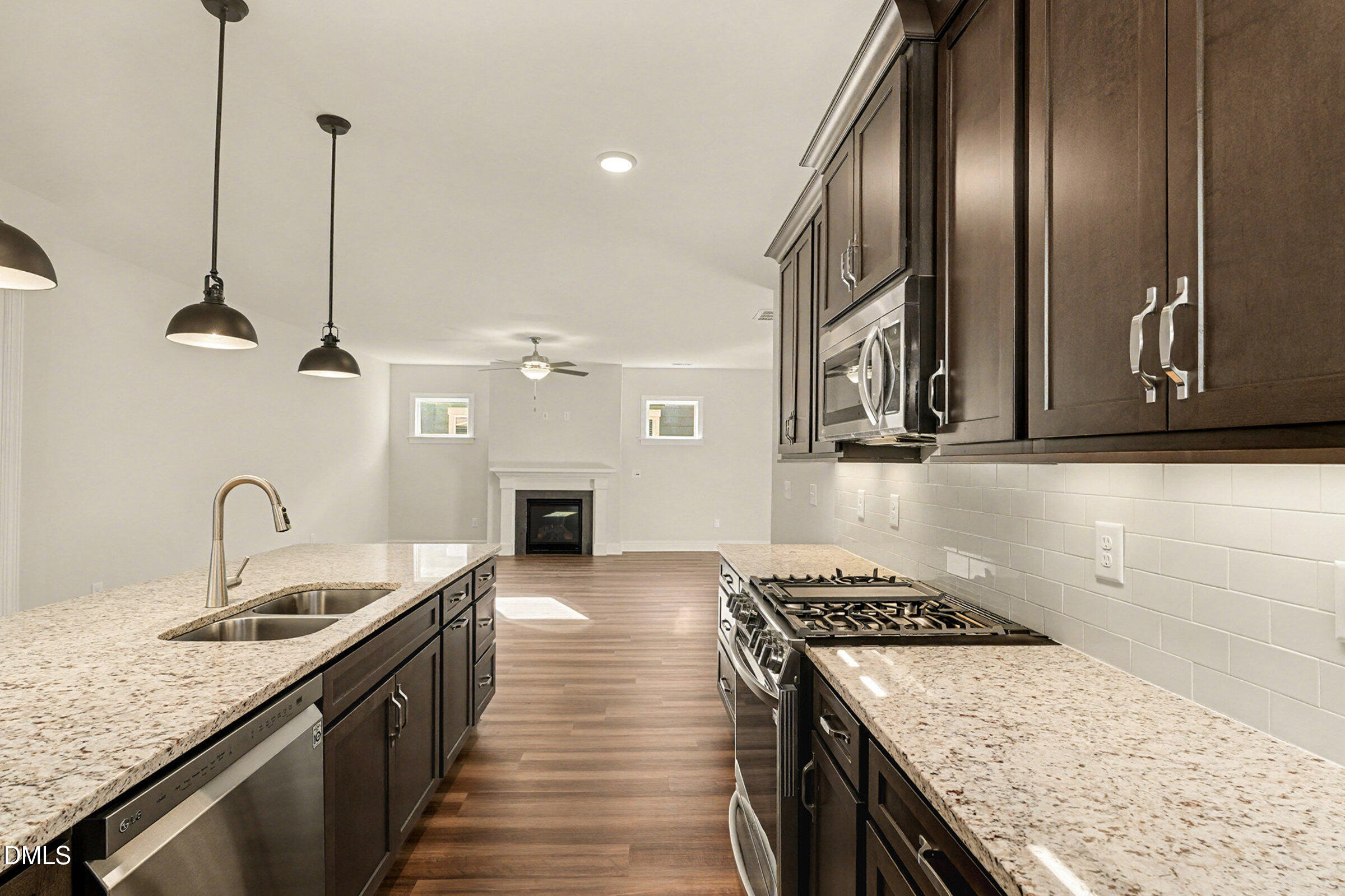43 Davidson Street Clayton, NC 27520 - Photo 14 of 45 a kitchen with a sink stove and refrigerator