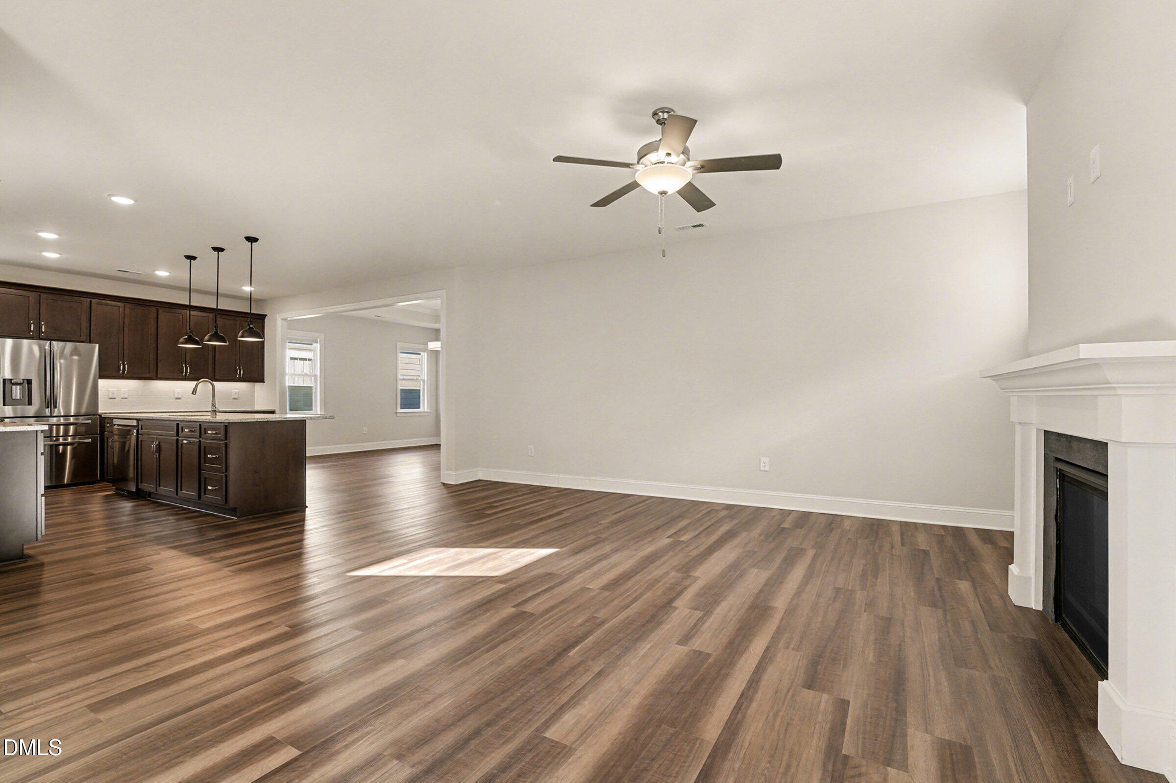 43 Davidson Street Clayton, NC 27520 - Photo 19 of 45 a view of a kitchen with furniture and wooden floor