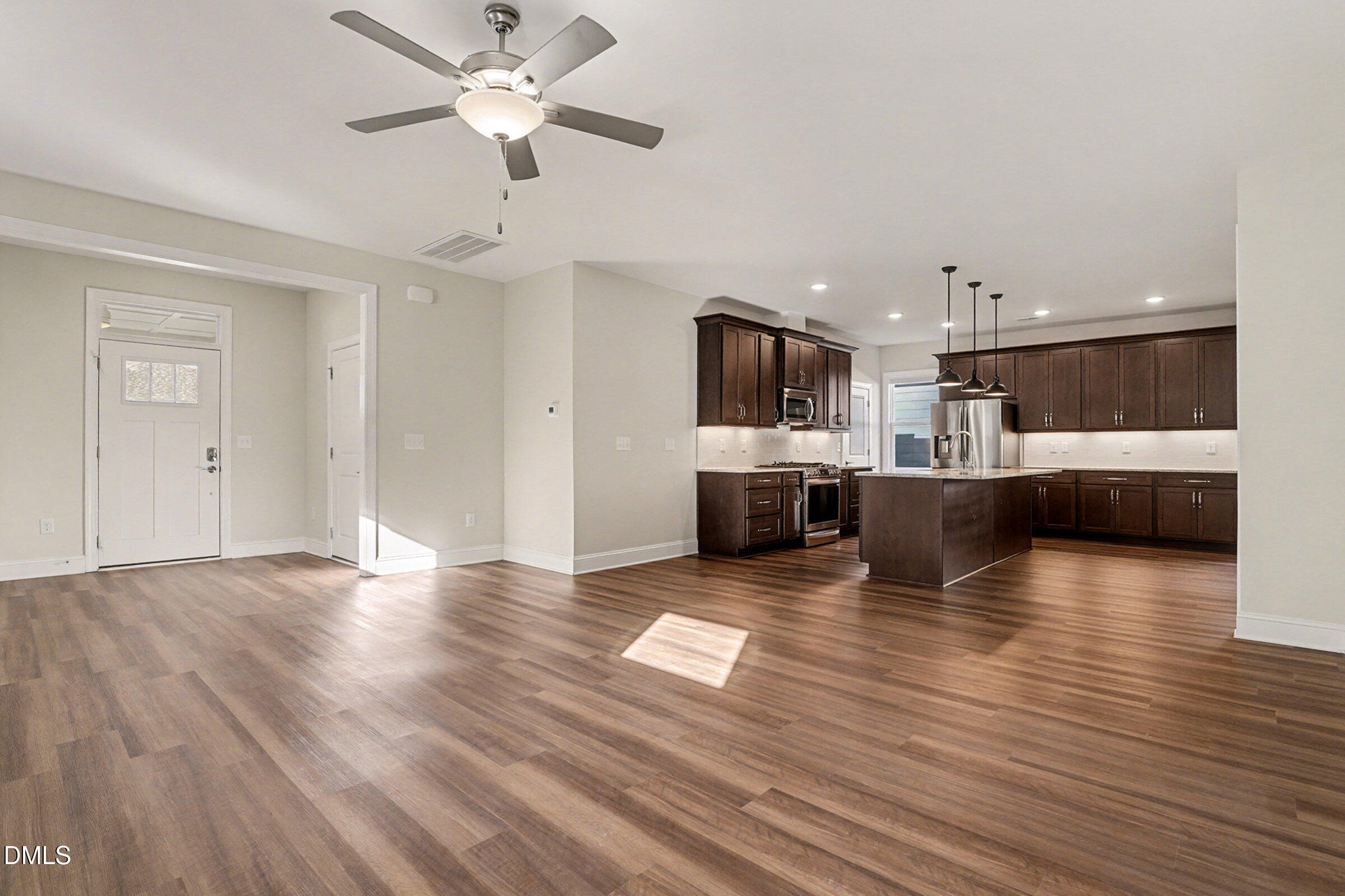 43 Davidson Street Clayton, NC 27520 - Photo 20 of 45 a view of kitchen and dining room with wooden floor