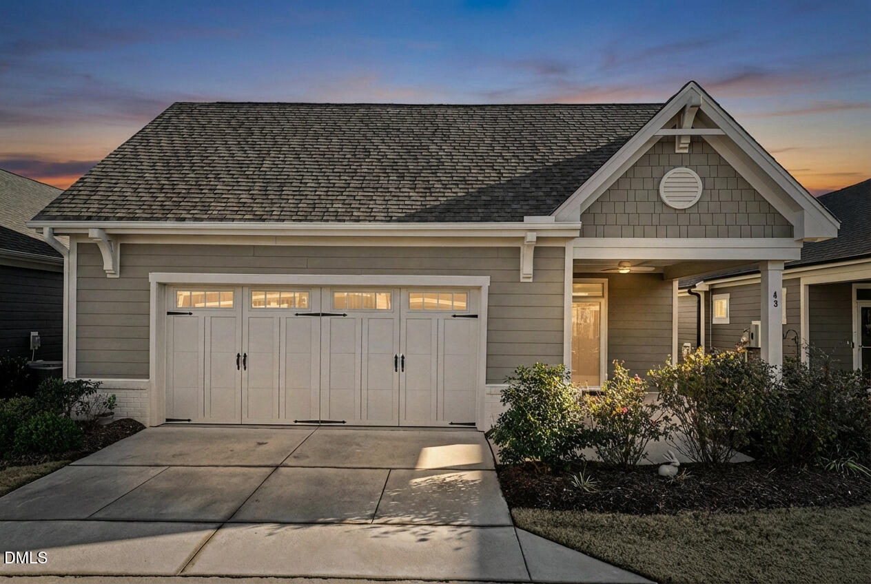 43 Davidson Street Clayton, NC 27520 - Photo 2 of 45 a front view of a house with garden