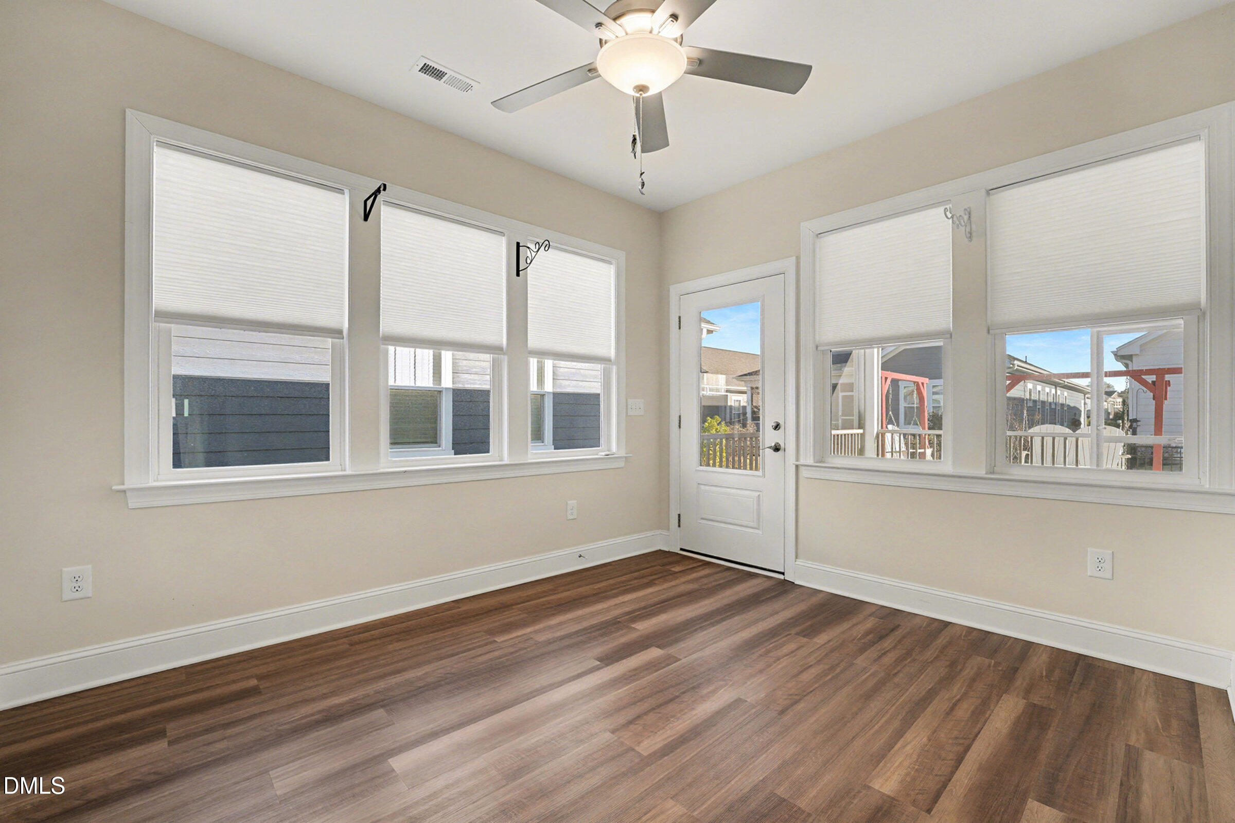 43 Davidson Street Clayton, NC 27520 - Photo 24 of 45 a view of empty room with wooden floor and fan