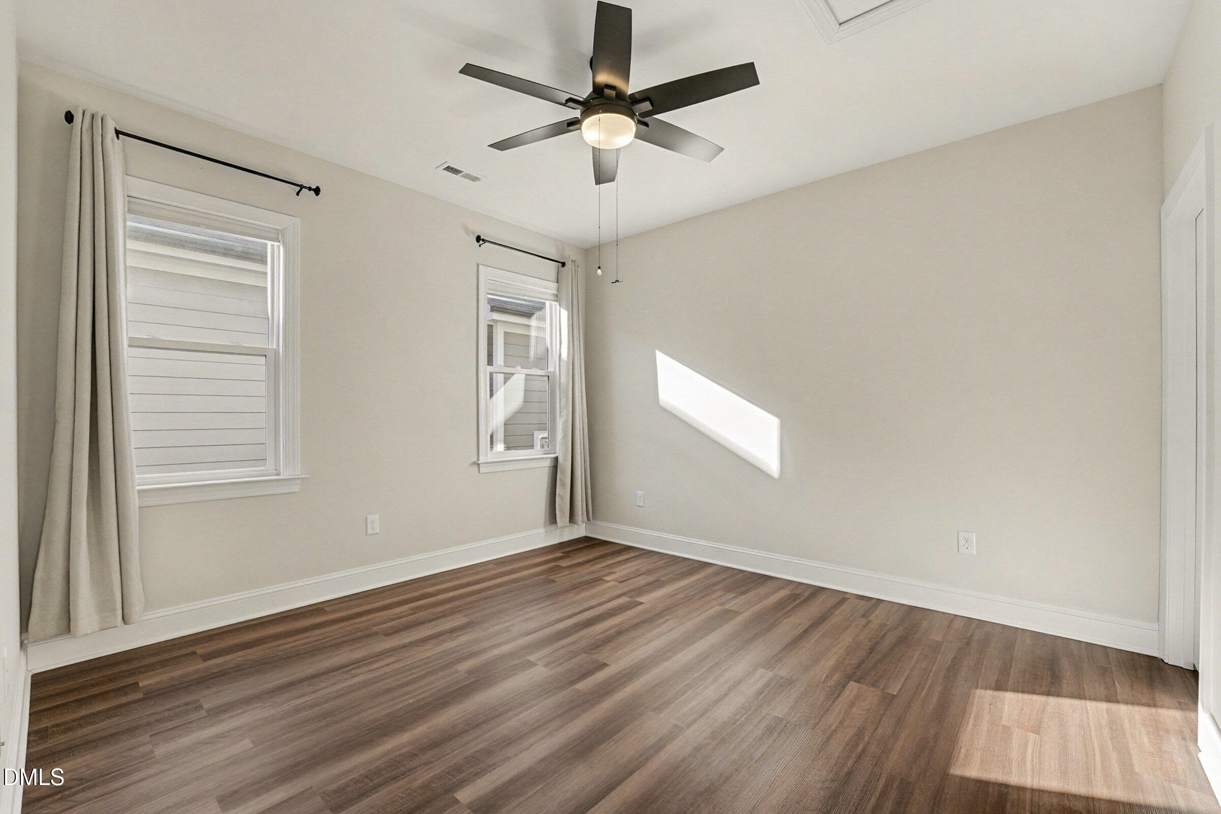 43 Davidson Street Clayton, NC 27520 - Photo 26 of 45 wooden floor in an empty room with a window