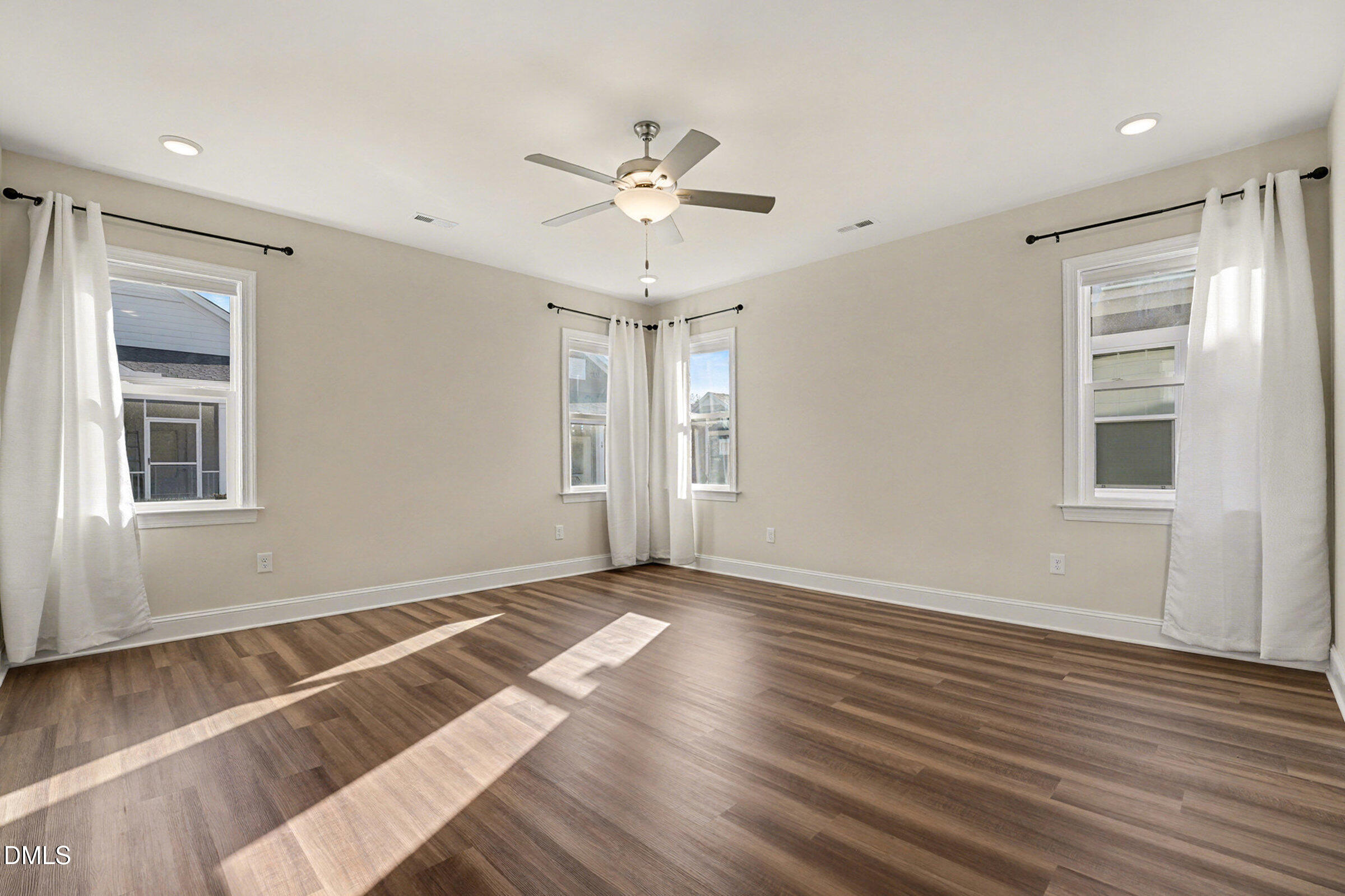 43 Davidson Street Clayton, NC 27520 - Photo 29 of 45 a view of an empty room with wooden floor and a window