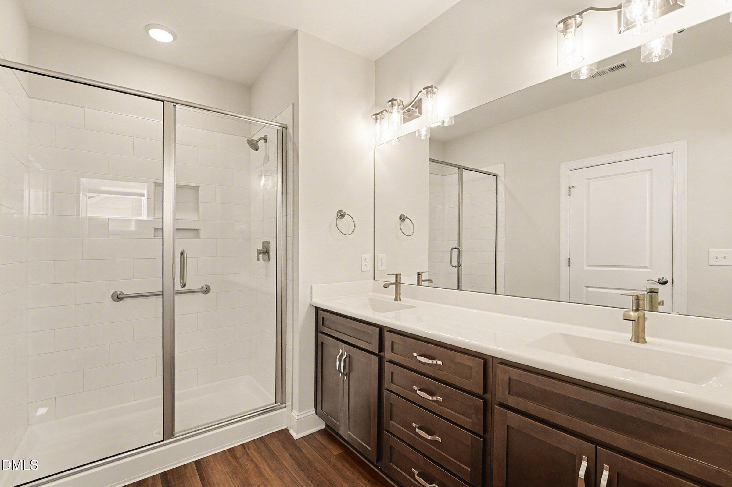 43 Davidson Street Clayton, NC 27520 - Photo 31 of 45 a bathroom with a sink double vanity and shower