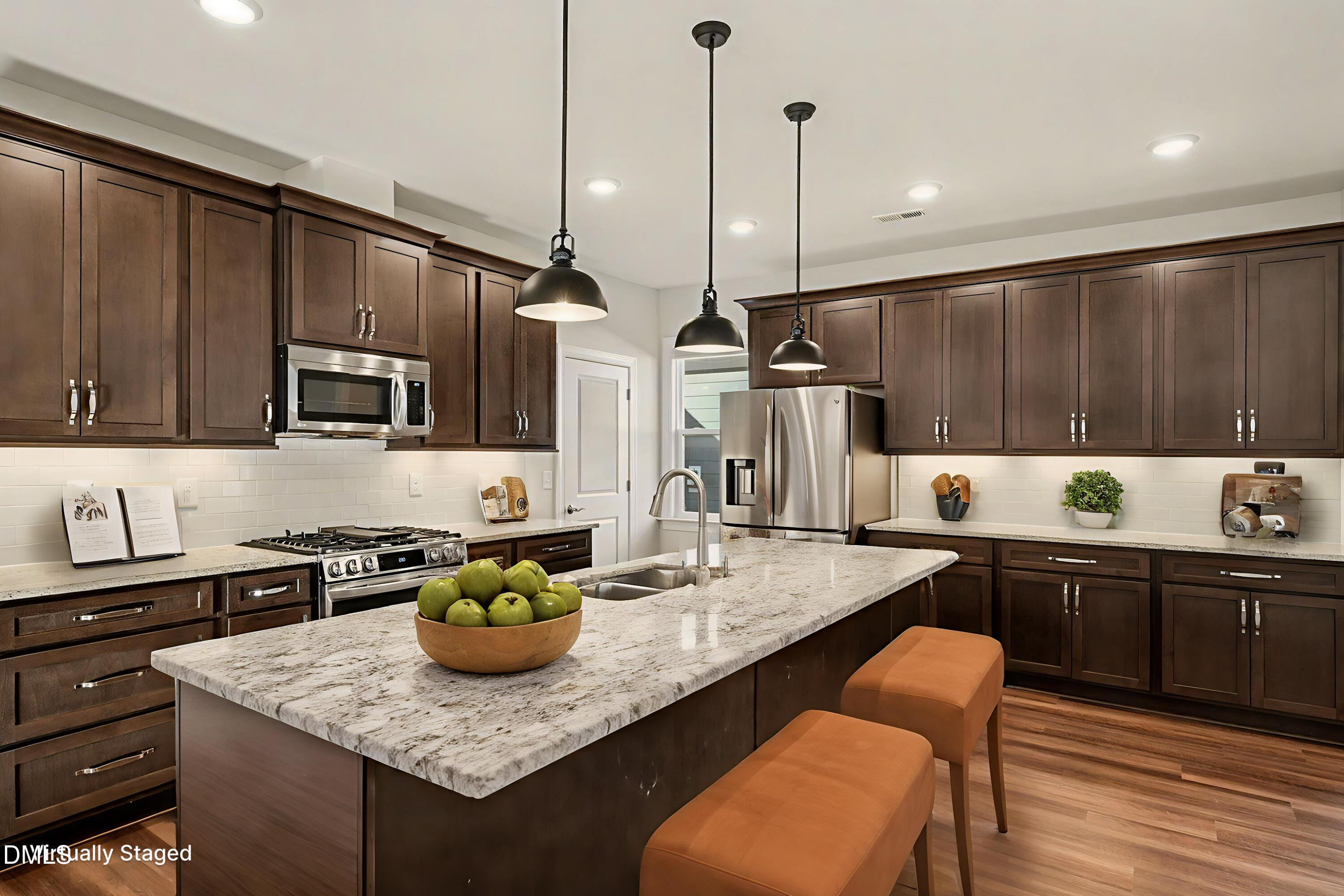 43 Davidson Street Clayton, NC 27520 - Photo 8 of 45 a kitchen with stainless steel appliances granite countertop a sink a stove and a wooden floors