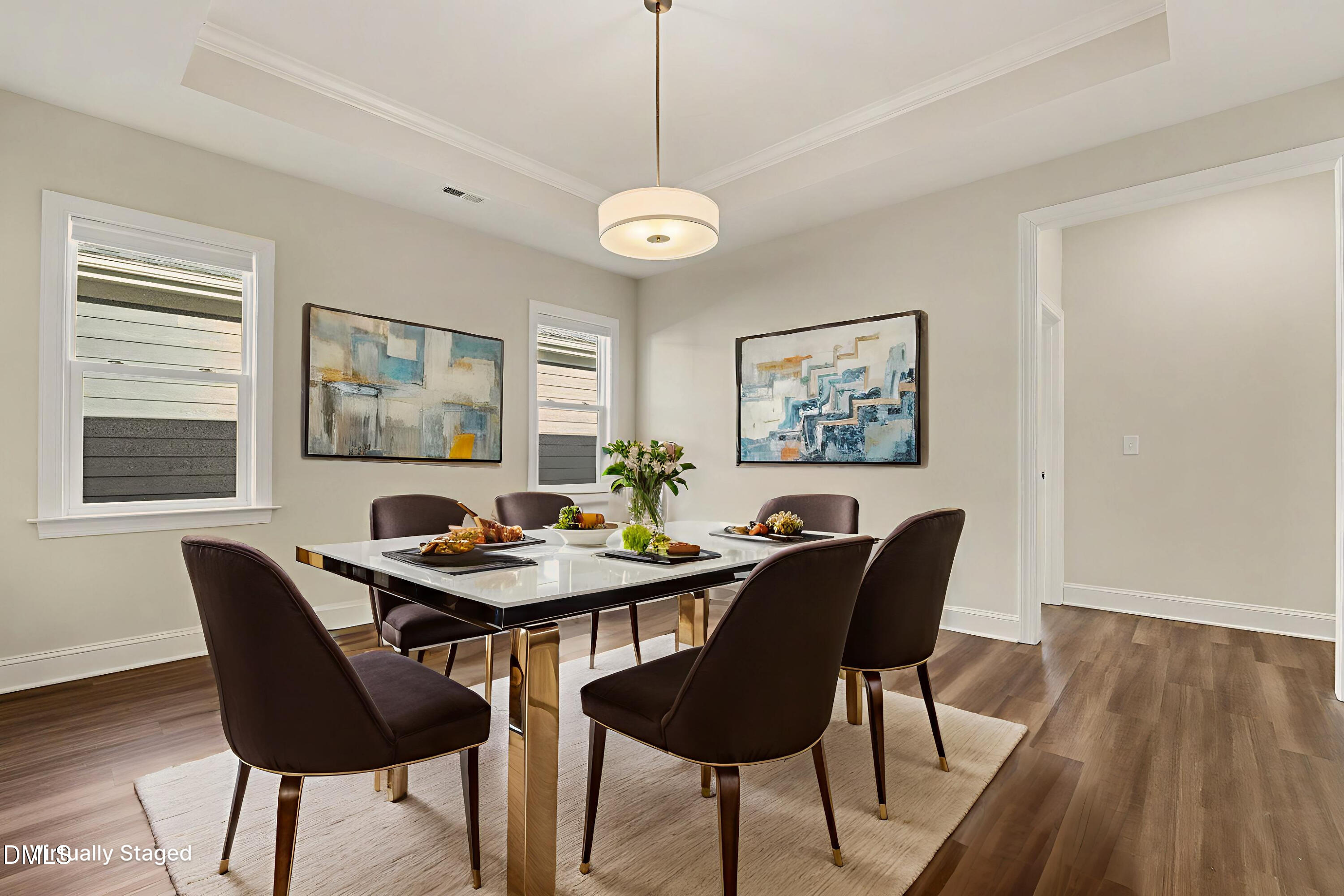 43 Davidson Street Clayton, NC 27520 - Photo 9 of 45 a view of a dining room with furniture window and wooden floor