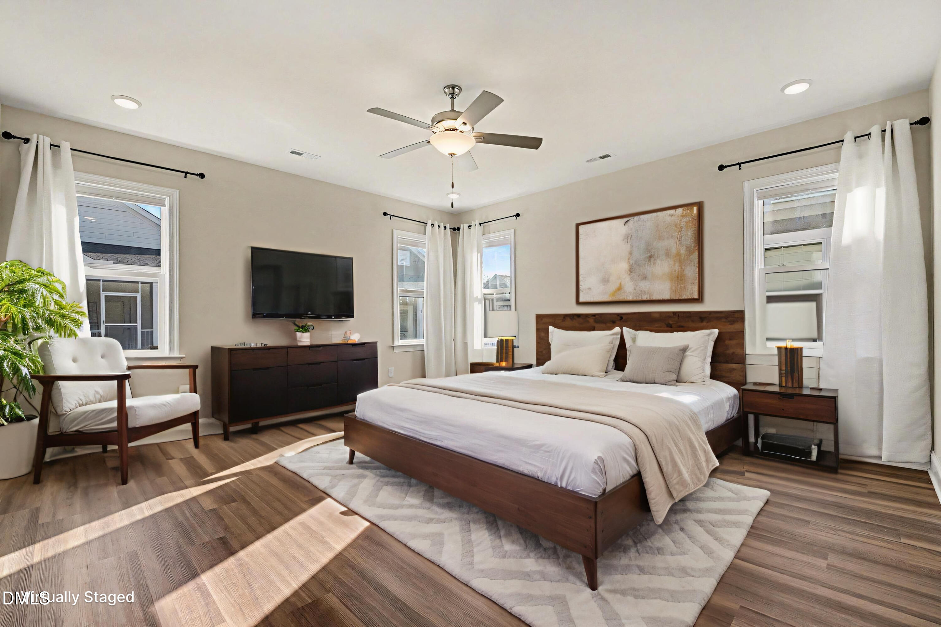 43 Davidson Street Clayton, NC 27520 - Photo 10 of 45 a bedroom with a bed and a flat screen tv