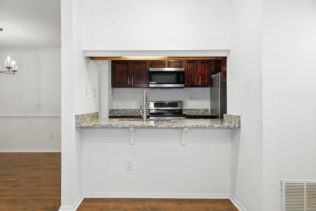 217 Tuxworth Circle Decatur, GA 30033 - Photo 11 of 38 a living room with a sink and a microwave