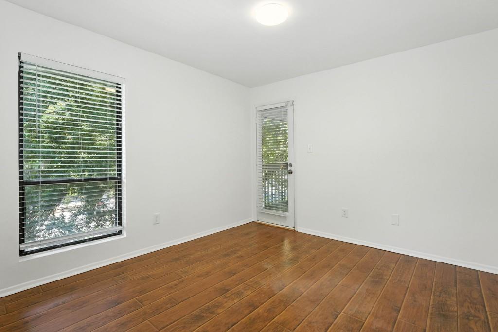217 Tuxworth Circle Decatur, GA 30033 - Photo 13 of 38 an empty room with wooden floor and window