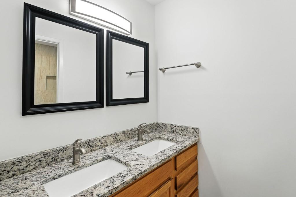 217 Tuxworth Circle Decatur, GA 30033 - Photo 15 of 38 a bathroom with a granite countertop sink and a mirror