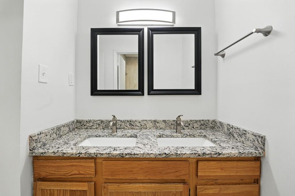217 Tuxworth Circle Decatur, GA 30033 - Photo 16 of 38 a bathroom with a granite countertop sink and a mirror