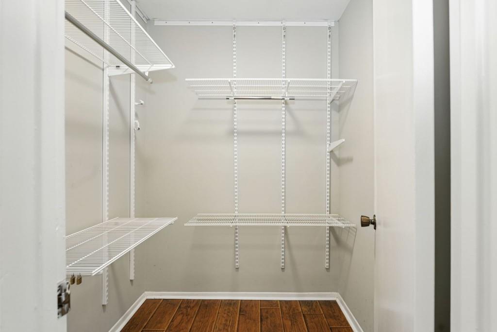 217 Tuxworth Circle Decatur, GA 30033 - Photo 27 of 38 a view of walk in closet with empty racks