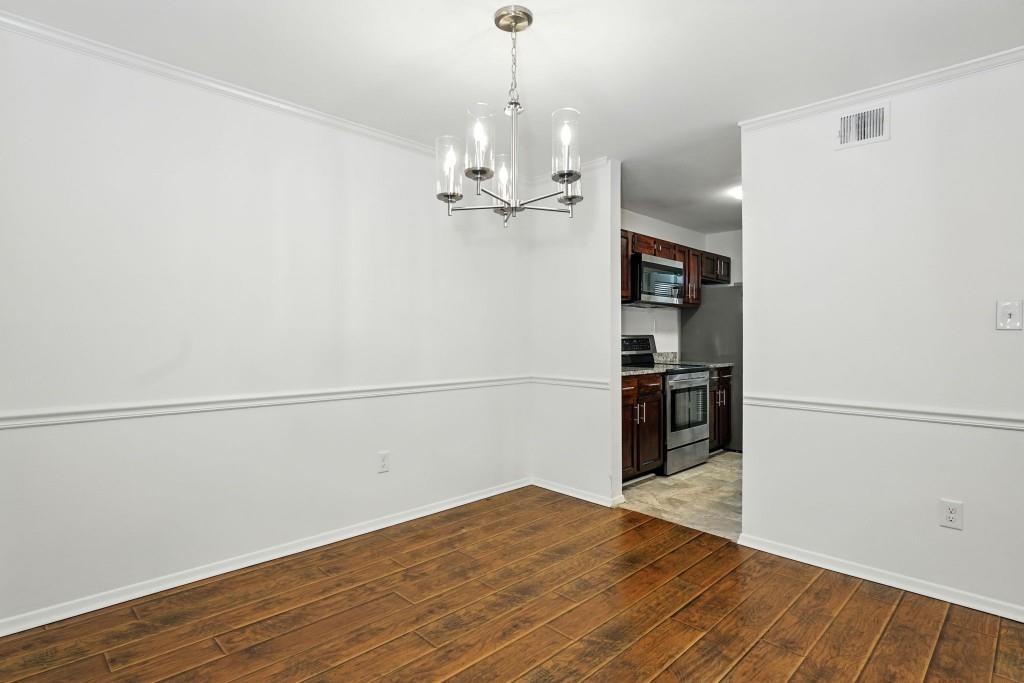 217 Tuxworth Circle Decatur, GA 30033 - Photo 3 of 38 a view of a kitchen with a refrigerator and a ceiling fan