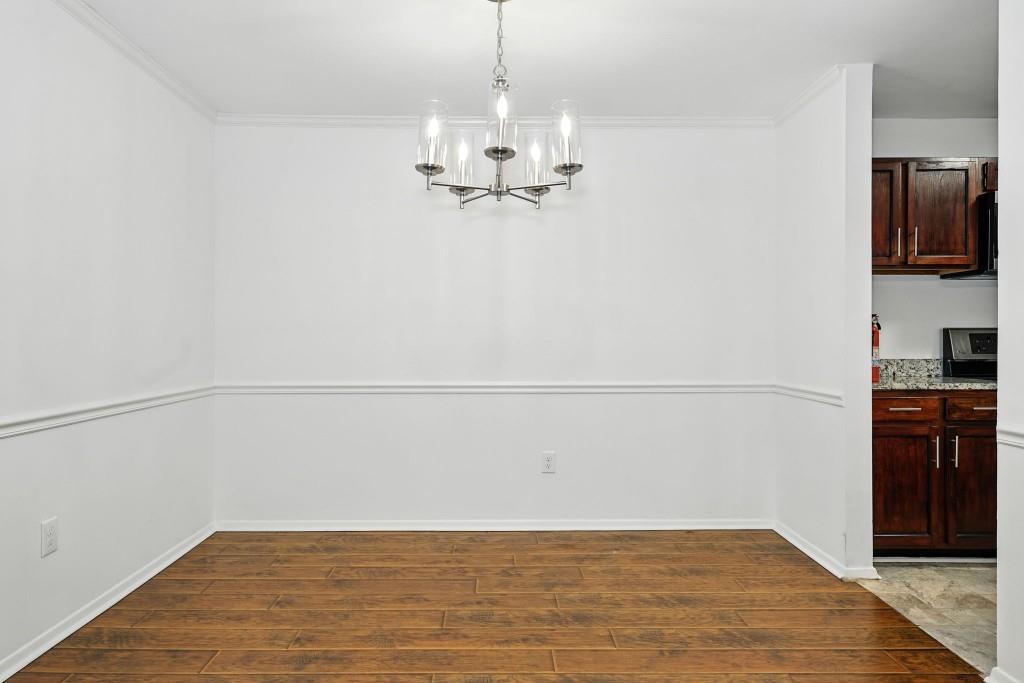 217 Tuxworth Circle Decatur, GA 30033 - Photo 4 of 38 a view of a kitchen with wooden floor and a sink