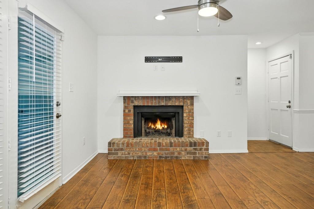 217 Tuxworth Circle Decatur, GA 30033 - Photo 9 of 38 a view of a livingroom with a fireplace a fireplace and wooden floor