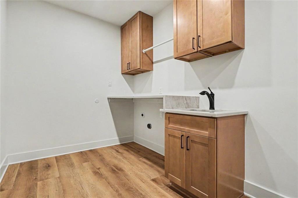 2700 Hawaii Court Decatur, GA 30033 - Photo 24 of 31 a view of a storage and utility room with wooden floor