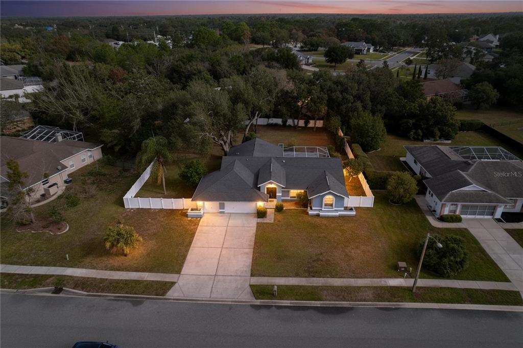 18812 Bascomb Lane Hudson, FL 34667 - Photo 12 of 57 an aerial view of a house with a yard