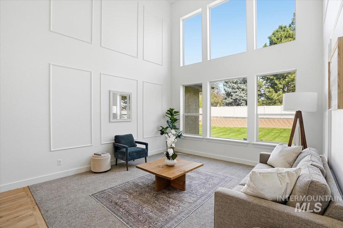 342 North Clearpoint Way Eagle, ID 83616 - Photo 2 of 50 Living area featuring a high ceiling and a decorative wall