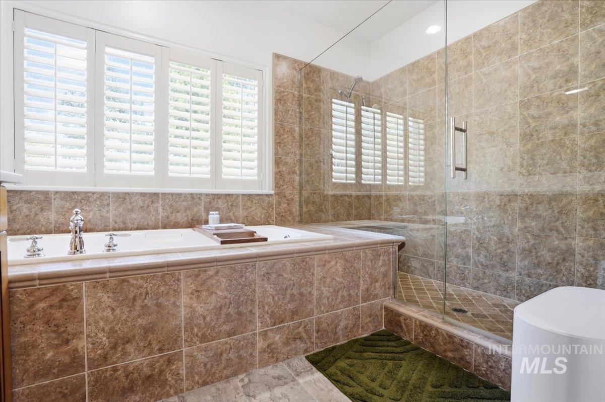 342 North Clearpoint Way Eagle, ID 83616 - Photo 22 of 50 Full bathroom featuring a stall shower and a garden tub