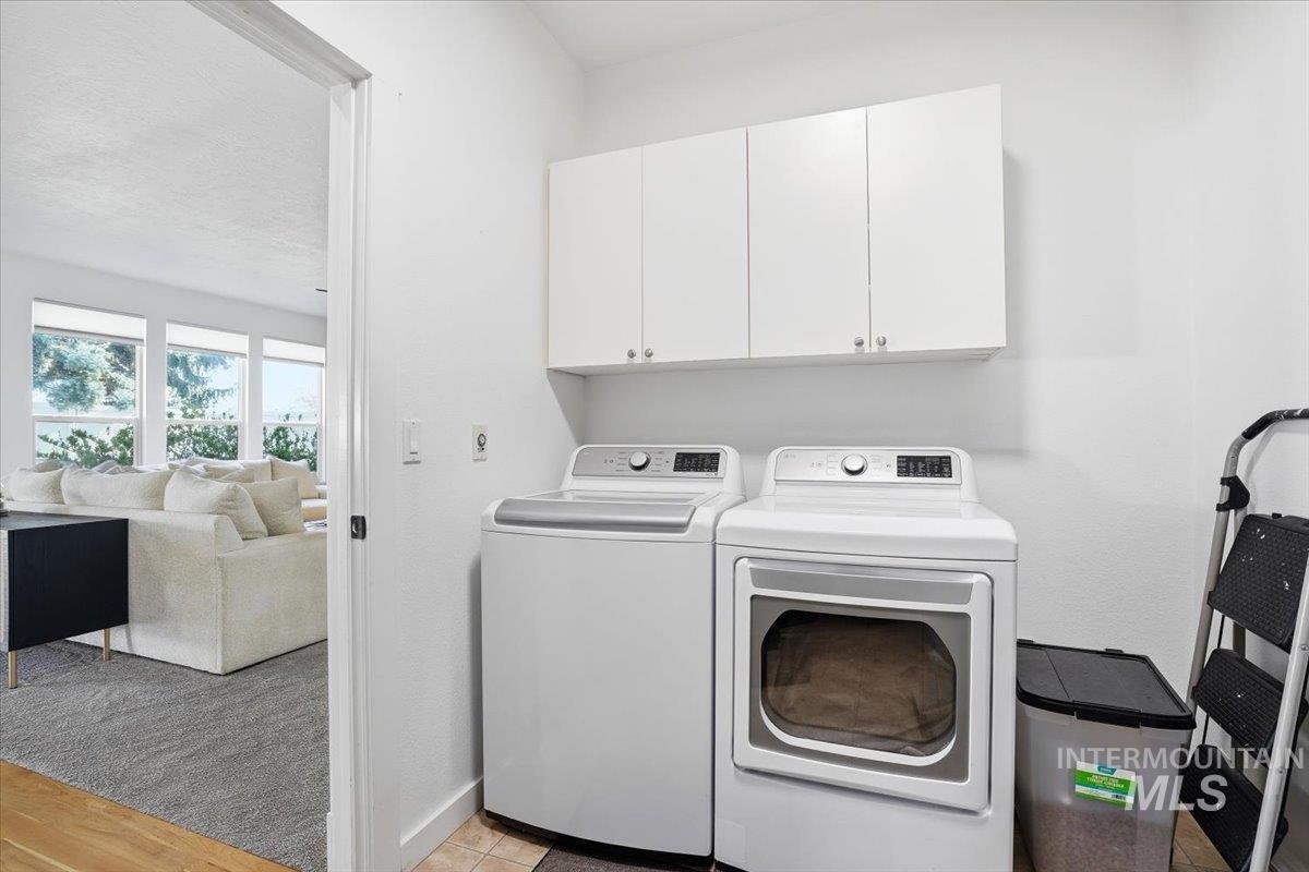 342 North Clearpoint Way Eagle, ID 83616 - Photo 24 of 50 Laundry room with cabinet space and washer and dryer