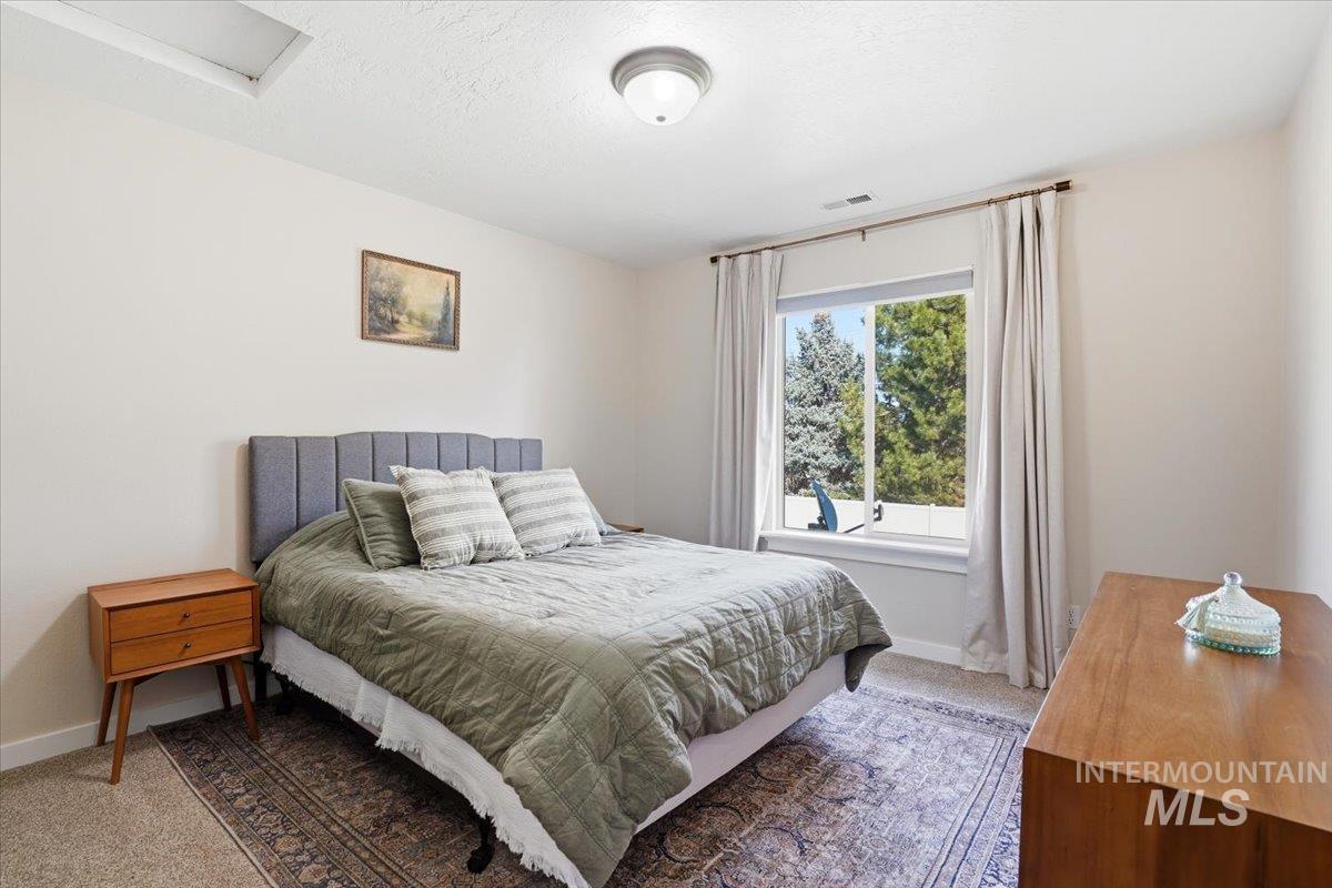 342 North Clearpoint Way Eagle, ID 83616 - Photo 30 of 50 Carpeted bedroom featuring baseboards and a textured ceiling