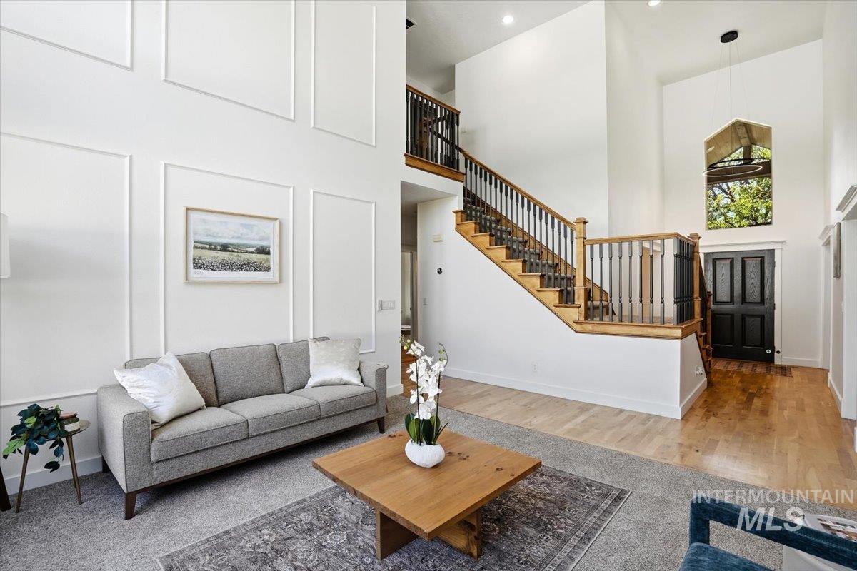 342 North Clearpoint Way Eagle, ID 83616 - Photo 3 of 50 Living area featuring a high ceiling and wood finished floors