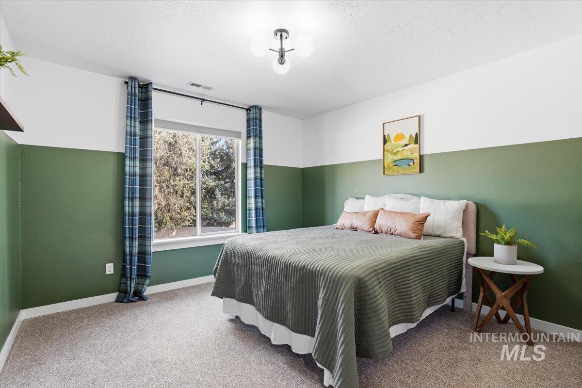 342 North Clearpoint Way Eagle, ID 83616 - Photo 32 of 50 Bedroom featuring light carpet and a textured ceiling