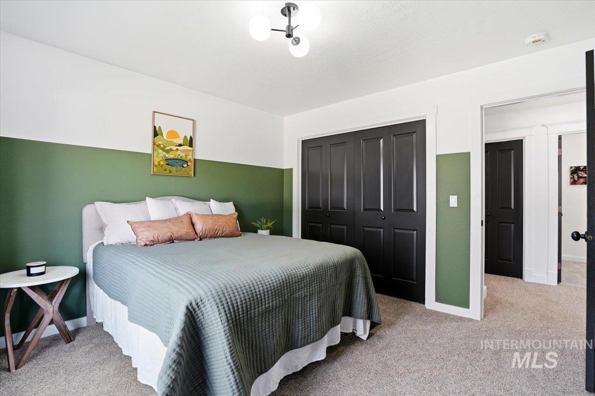 342 North Clearpoint Way Eagle, ID 83616 - Photo 33 of 50 Bedroom with light colored carpet and a closet