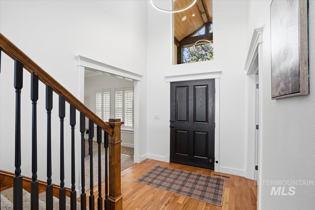342 North Clearpoint Way Eagle, ID 83616 - Photo 5 of 50 Foyer with lofted ceiling and light wood finished floors