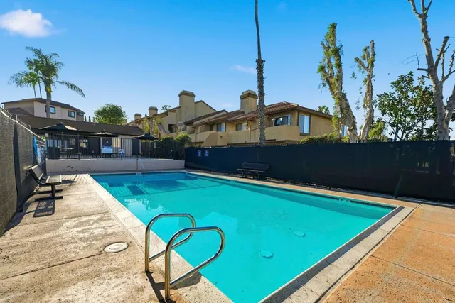 a view of swimming pool with a patio