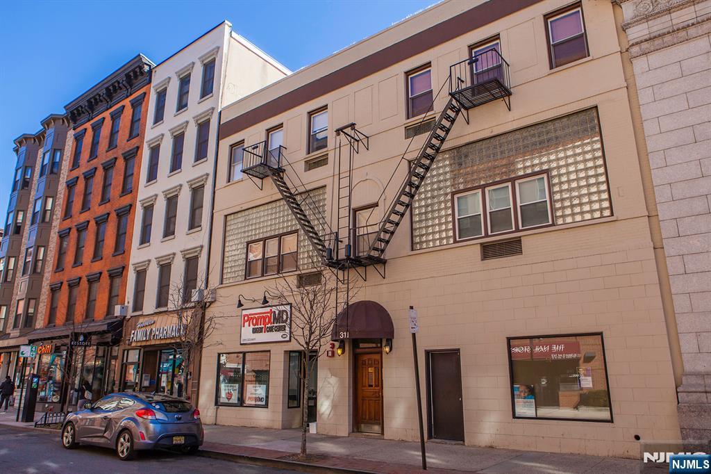 309 1st Street, Unit 3C Hoboken, NJ 07030 - Photo 13 of 13 a front view of a building with glass windows