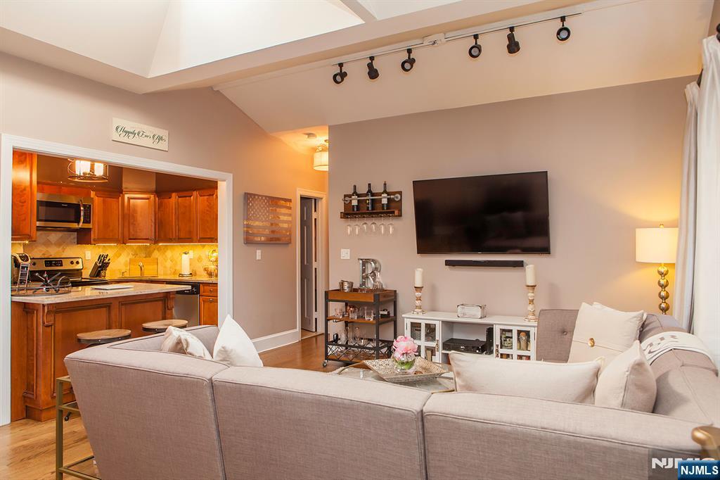 309 1st Street, Unit 3C Hoboken, NJ 07030 - Photo 2 of 13 a living room with furniture and a flat screen tv