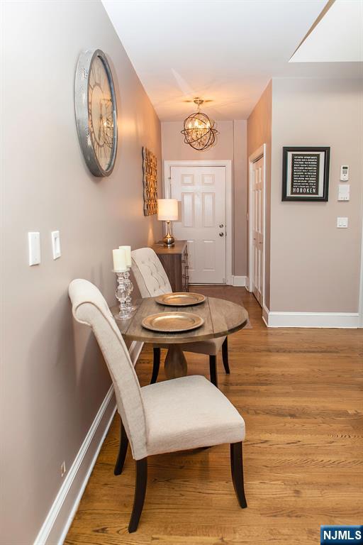 309 1st Street, Unit 3C Hoboken, NJ 07030 - Photo 7 of 13 a view of a room with a table and chairs