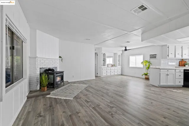 a view of a kitchen with furniture and a fireplace