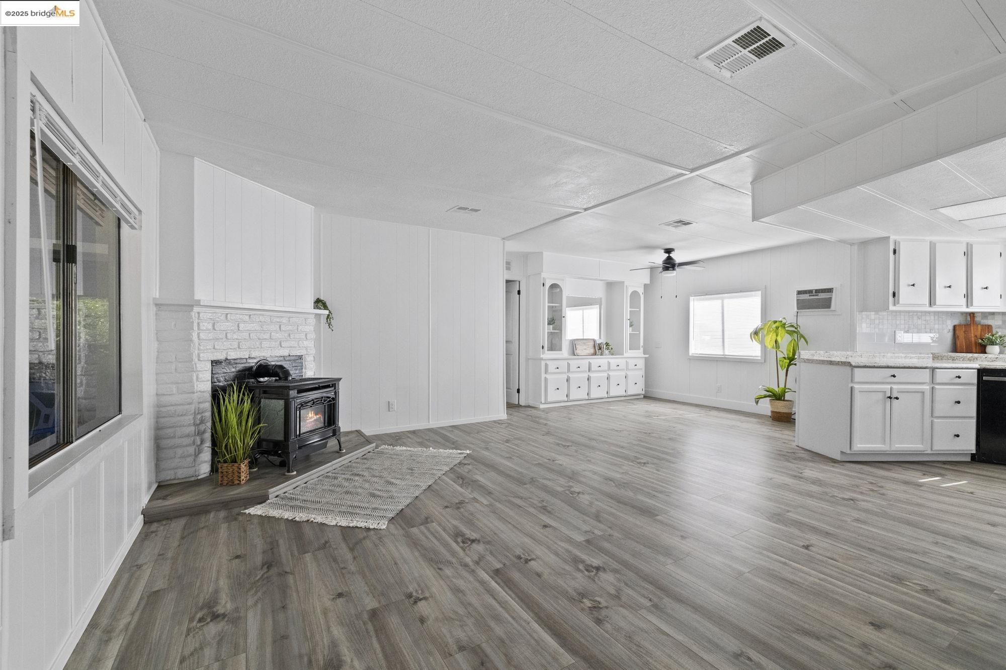 a view of a kitchen with furniture and a fireplace