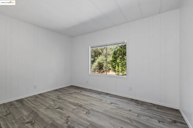 a view of small space with wooden floor