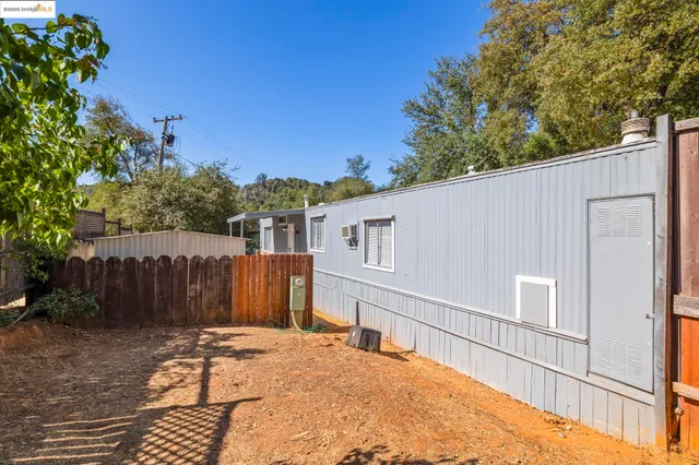 a backyard of a house with lots of green space