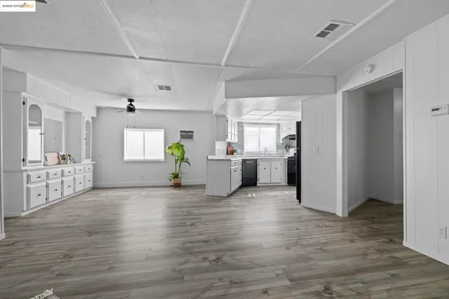 a view of a kitchen with a sink and a window
