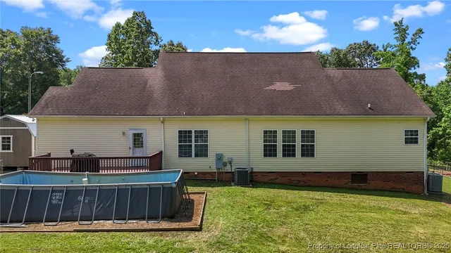 a front view of house with yard and outdoor seating
