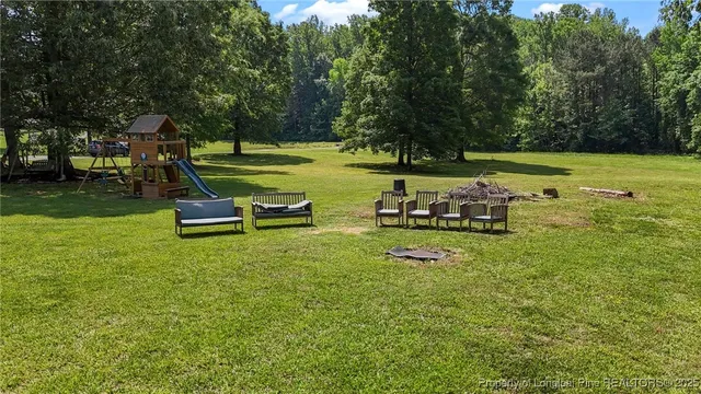 a view of a park with large trees